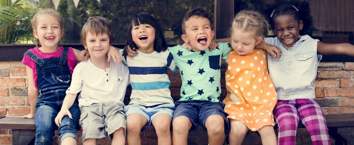 Group of young Aberlour supported children sitting on a bench