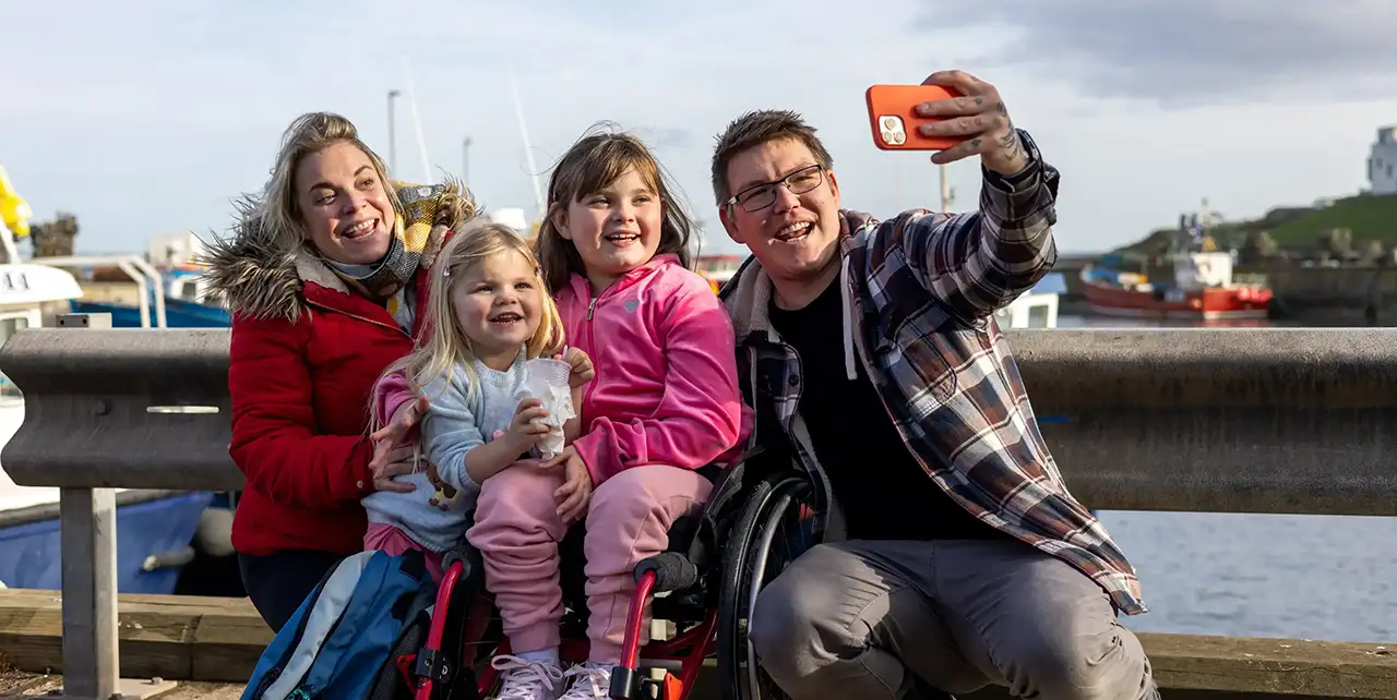 Mothers taking a selfie together outdoors at an Aberlour Family Voices event