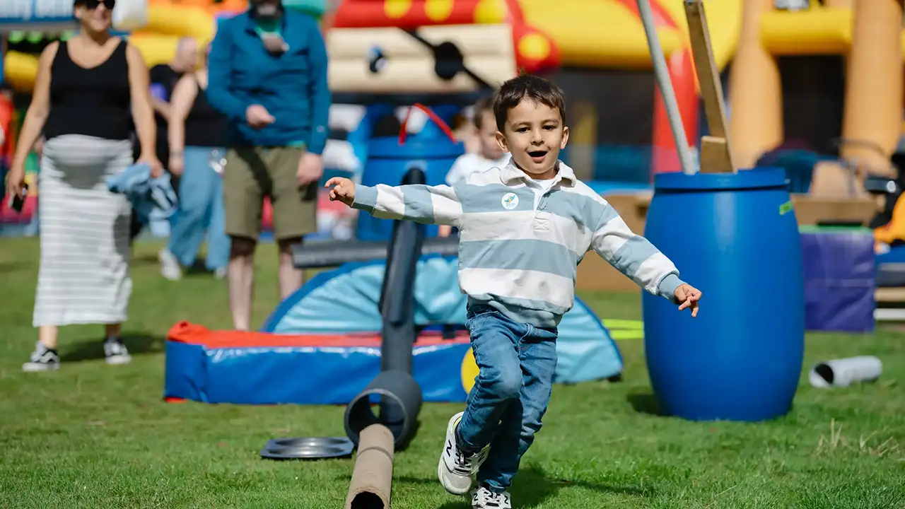 A boy running through an obstacle course at Aberlour's National Day for Play event